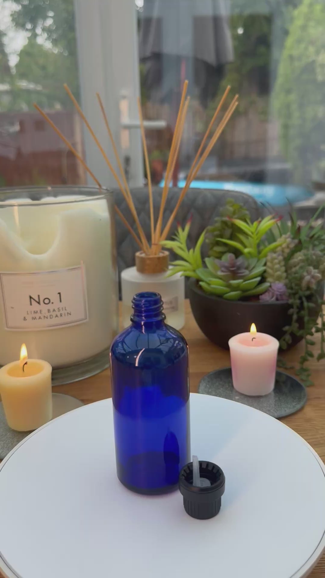 100ml Blue glass dropper bottle with black tamper evident cap with dripper insert. carousel