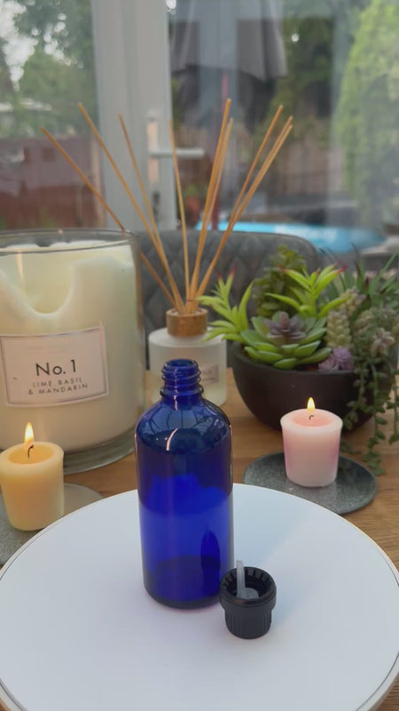 100ml Blue glass dropper bottle with black tamper evident cap with dripper insert. carousel