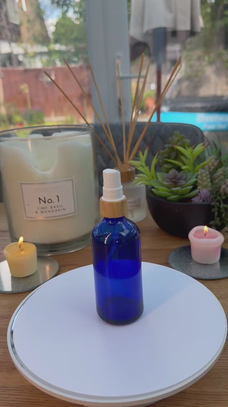 100ml blue glass Bottle with Bamboo and white atomiser carousel