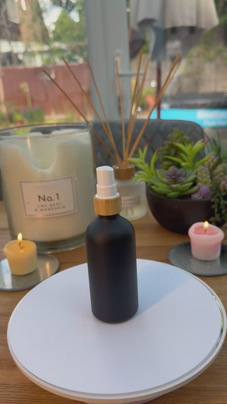 100ml Matte black Bottle with Bamboo and white atomiser on bottle